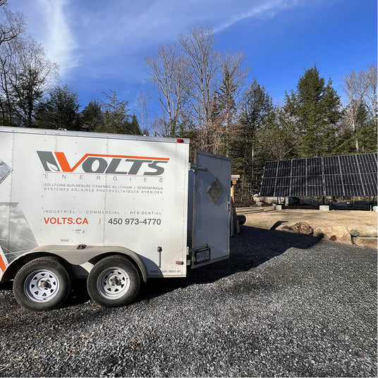 Volts Energies service trailer at off-grid solar panel installation site in Canada