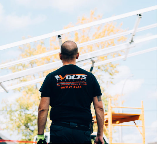 Volts Energies technician installing solar panels on rooftop