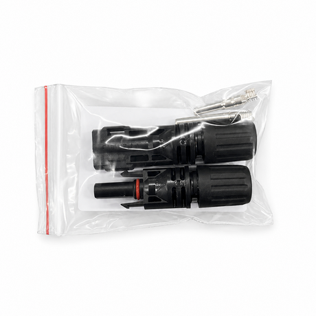 Two black connectors in a clear plastic bag on a white background