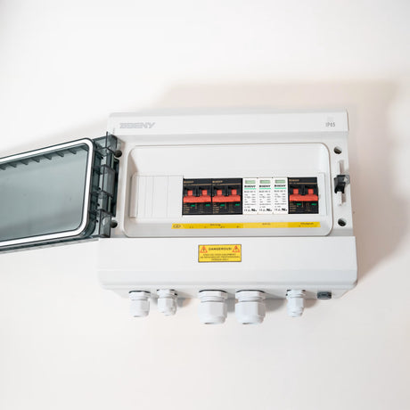 Open BENY BHS-2/1 DC combiner box showing breakers and surge protection devices