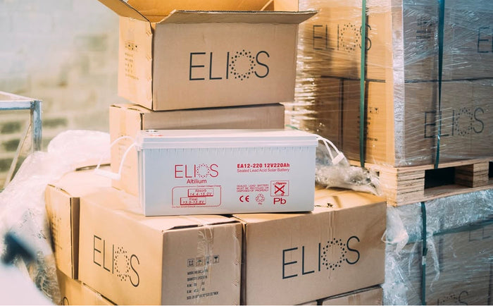 Stack of boxes with 'ELIOS' branding on a pallet.