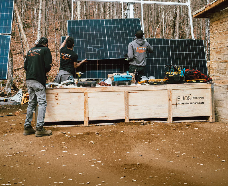 Certified technicians installing Elios solar panels on residential property